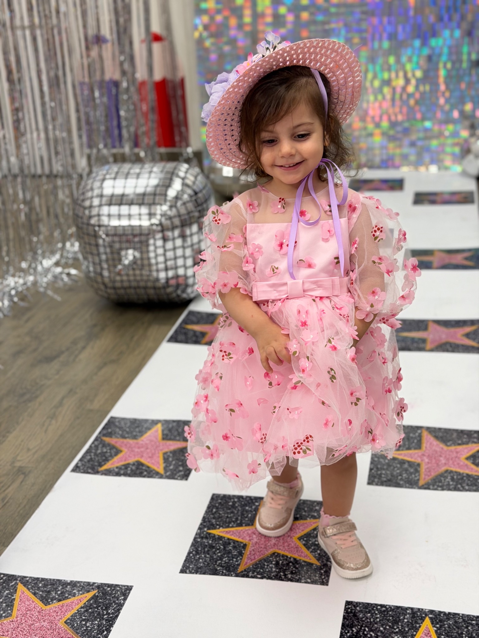 A young child enjoying creative dress-up play