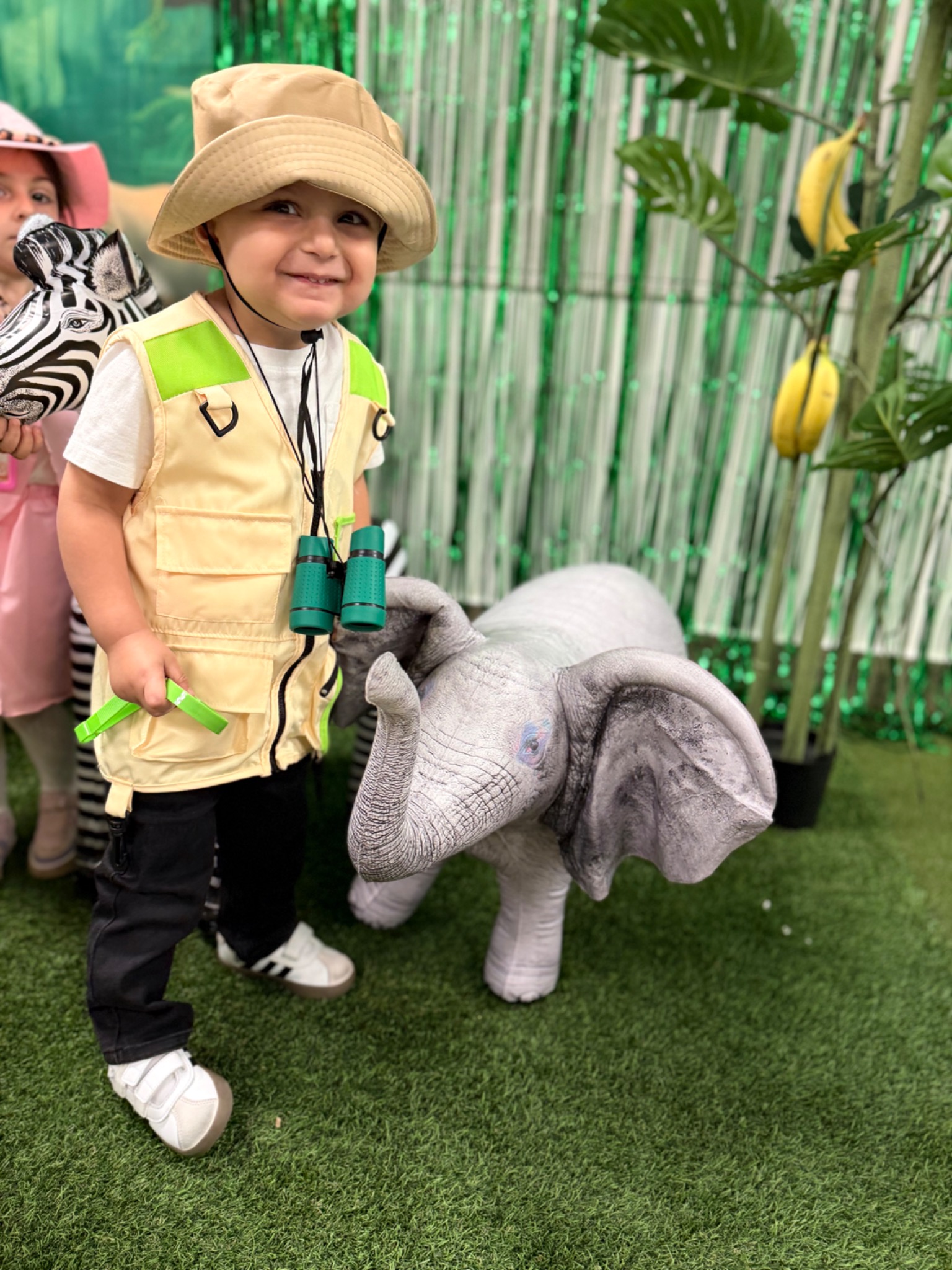 A young child taking part in imaginative classroom play