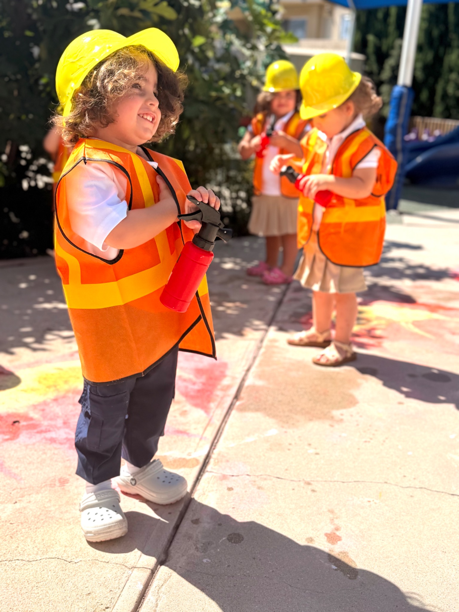 Young children participating in a colorful outdoor movement activity