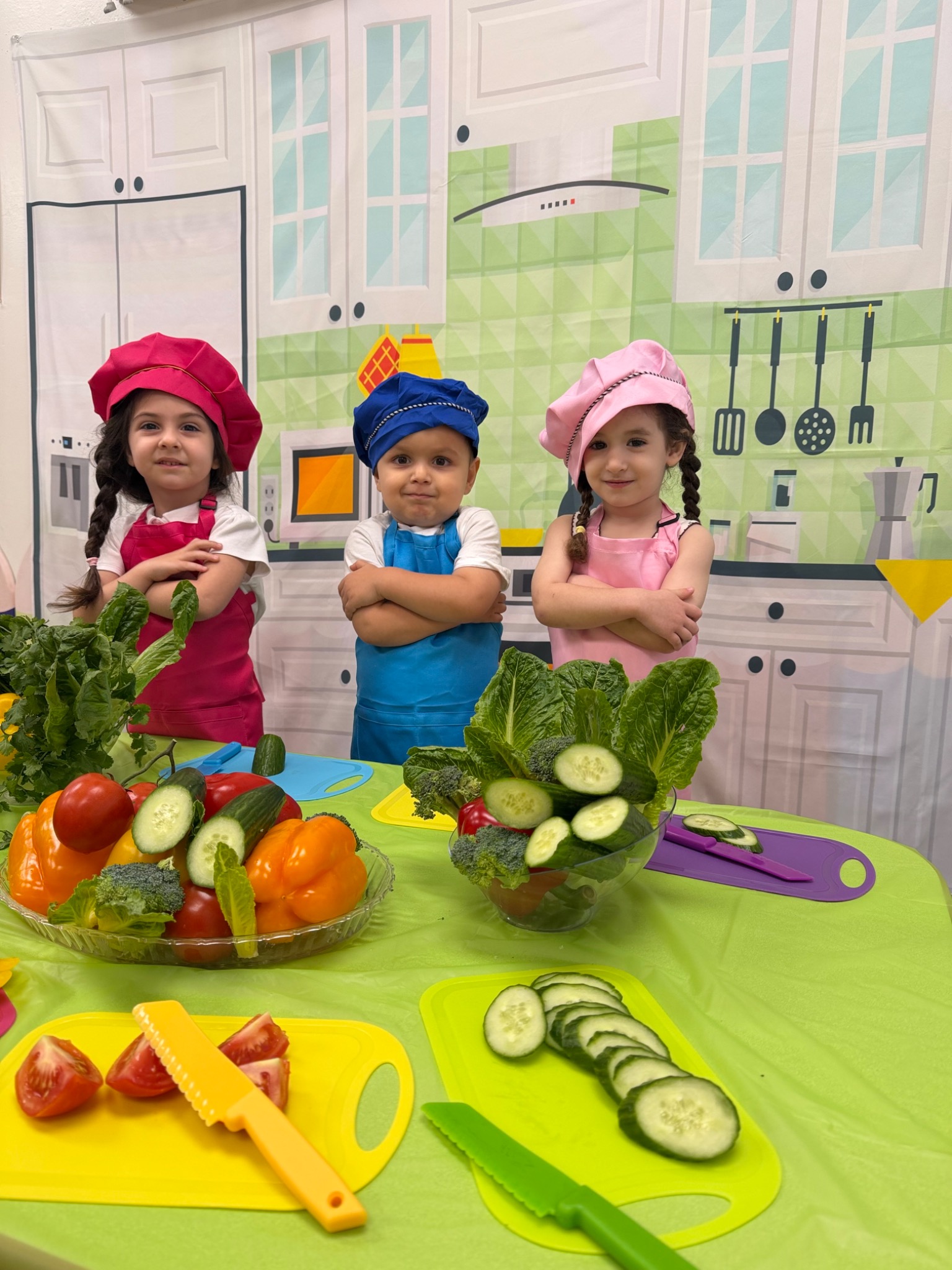 Young children preparing vegetables together during a practical-life activity
