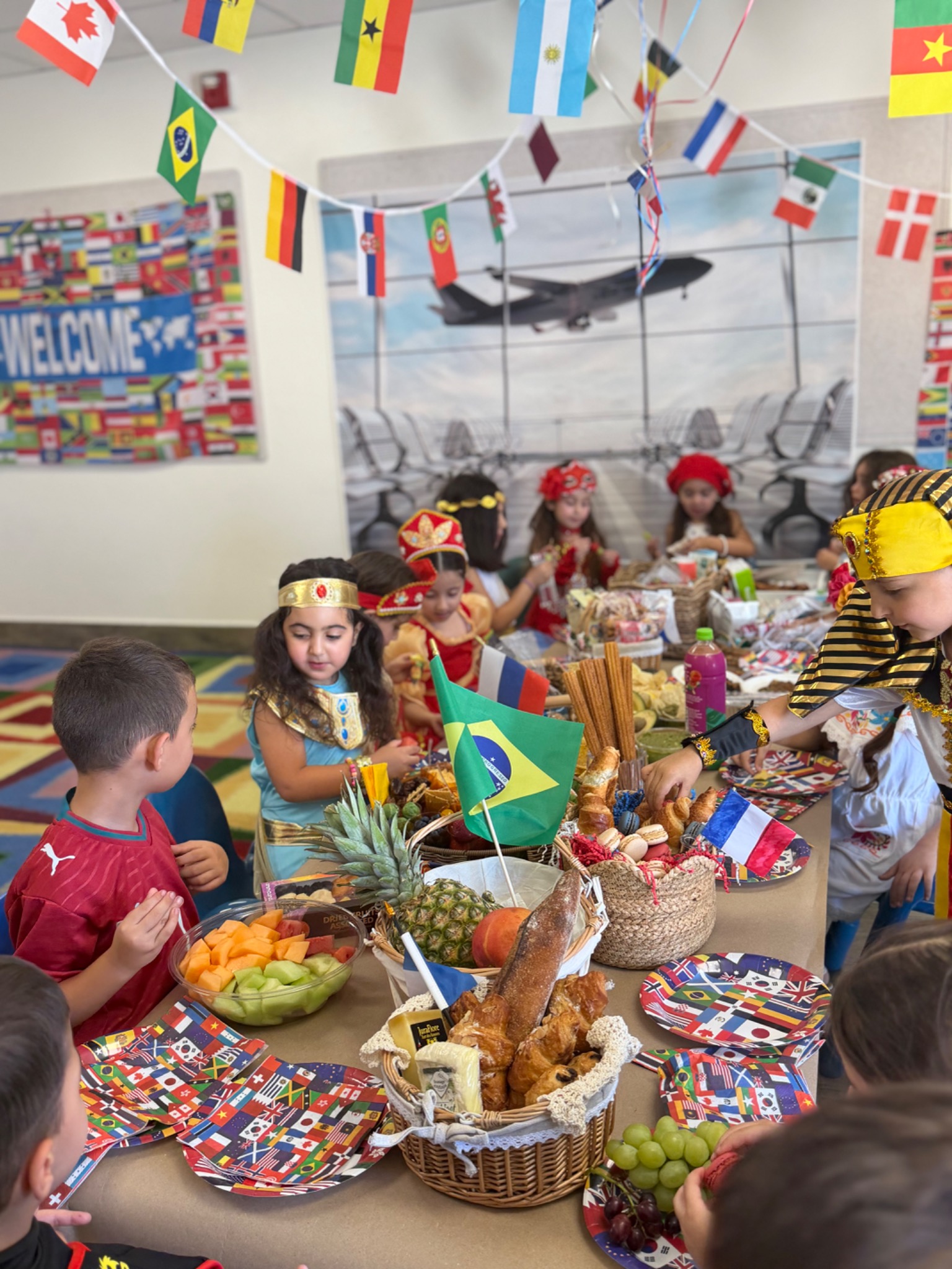 Kindergarten students exploring traditional clothing, foods and cultural materials