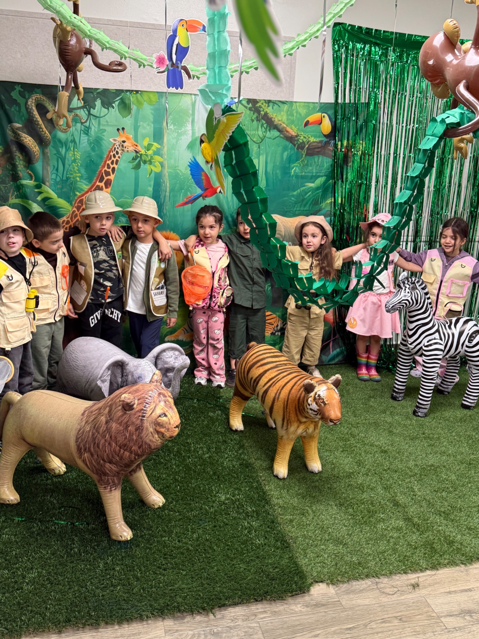 Kindergarten students participating in a rainforest-themed classroom learning experience